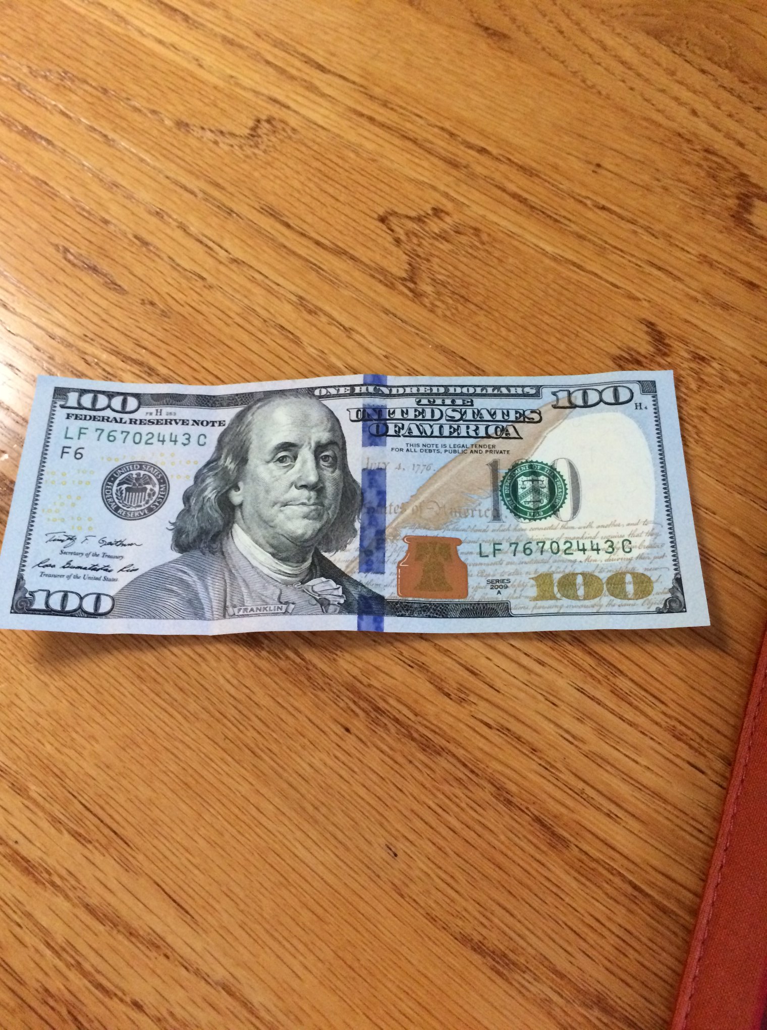 Photograph of a crisp 100 dollar bill