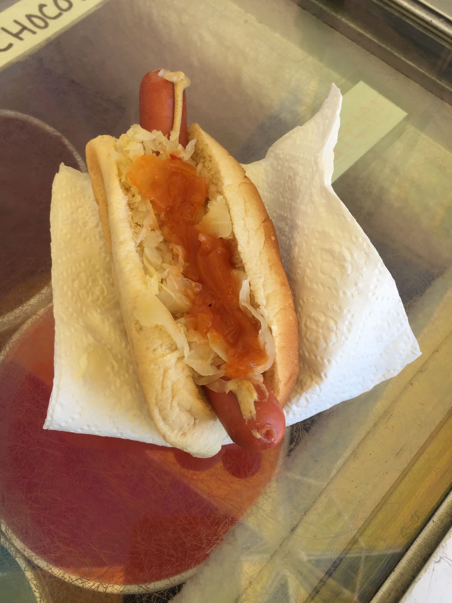 Picture of hotdog, sauerkraut, and onions